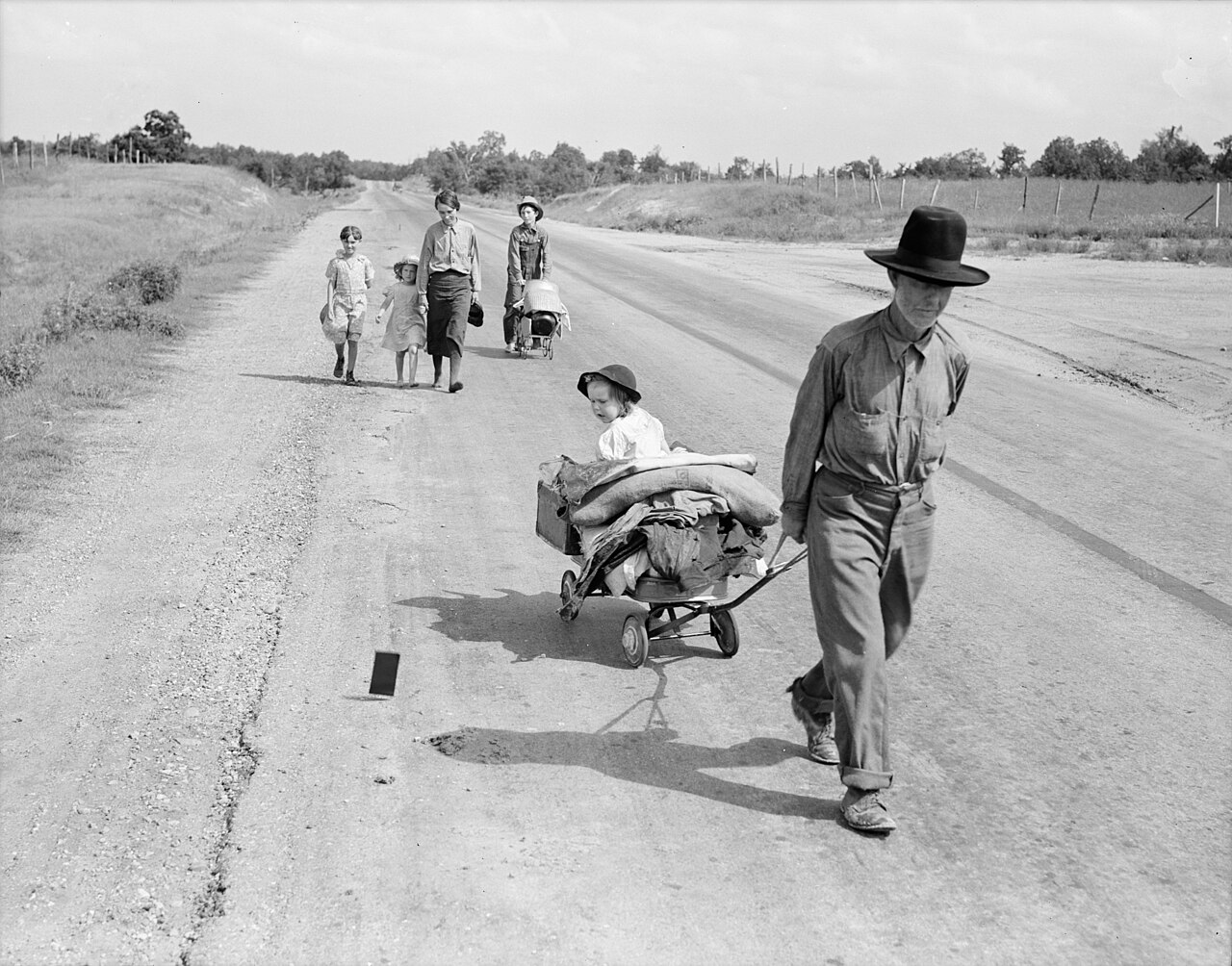 Dorothea Lange, family walking on highway, five children, Pittsburg County, Oklahoma, June 1938