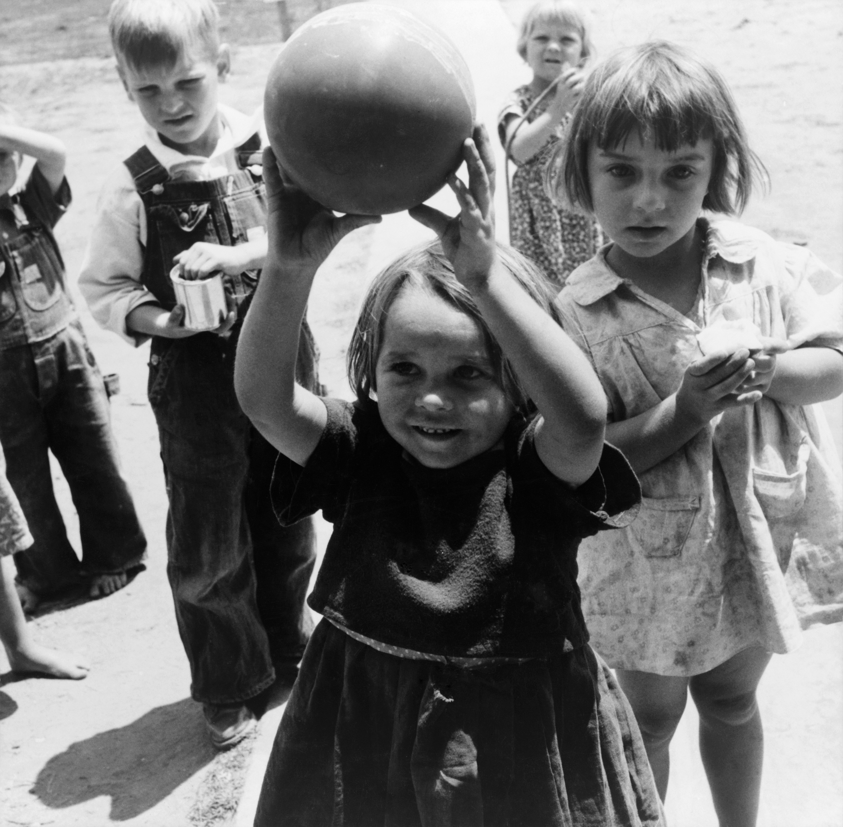 Dorothea Lange, migrant children playing at nursery school, FSA camp, Tulare County, California, 1939