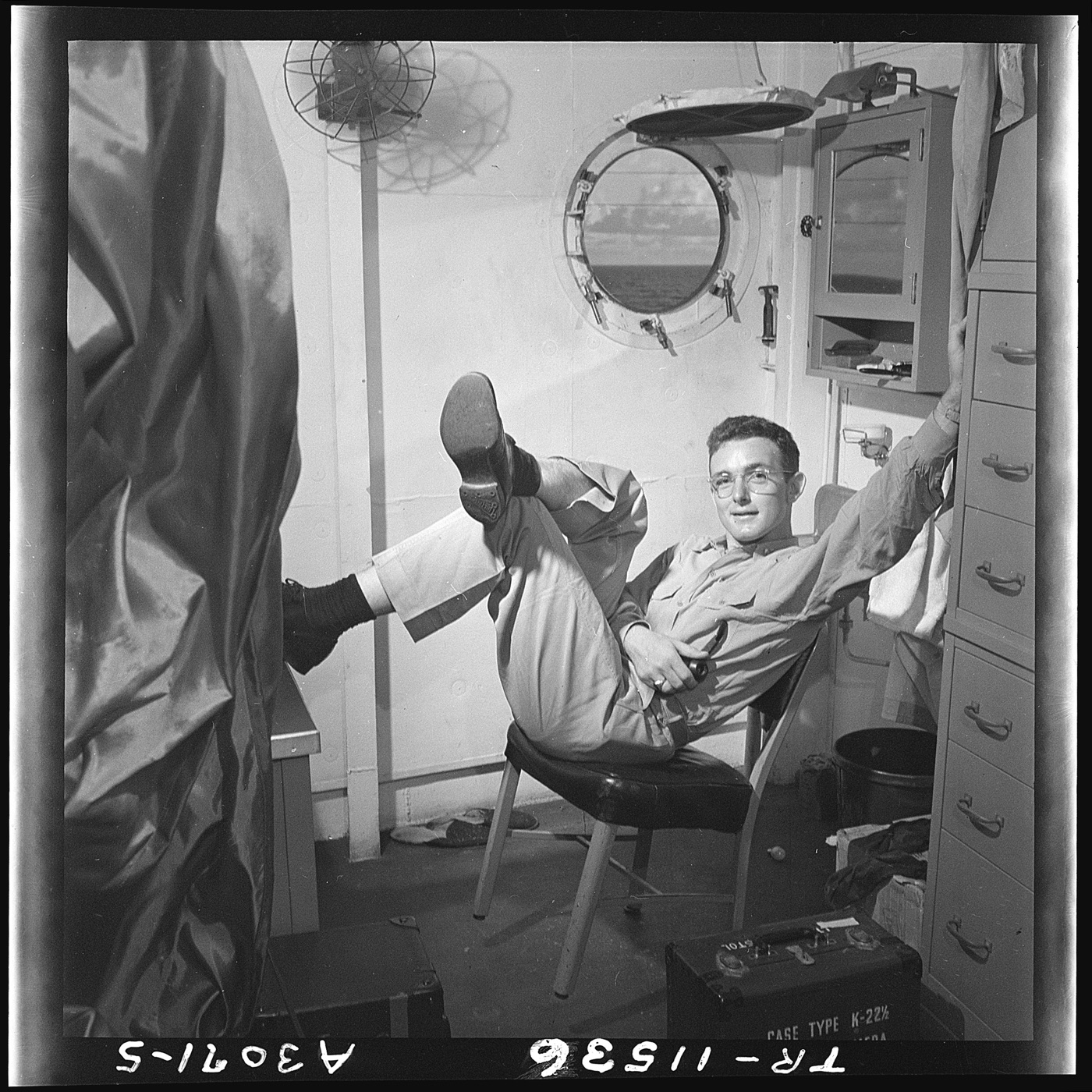 Lt. Wayne Miller in his quarters aboard the USS Ticonderoga, 1945