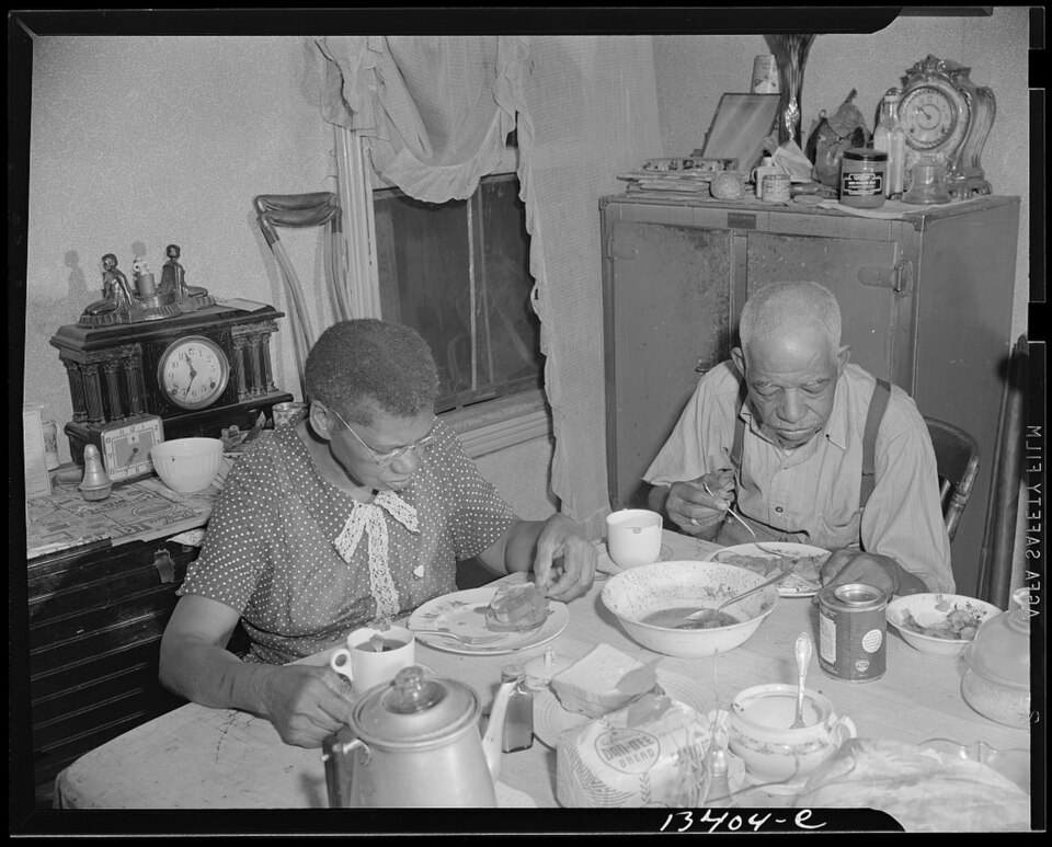 Gordon Parks, elderly couple eating dinner at home, Lamont Street NW, Washington D.C., June 1942